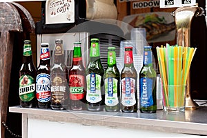 Set of Polish beer bottles in a row, various brands, many alcohol bottles and plastic straws in container ÃÂ»ubr, LeÃÂ¼ajsk, DÃâ¢bowe